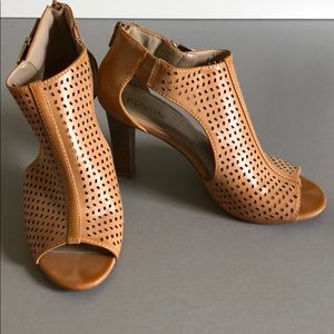 Brown sandal heels with peep toe and bootie shape